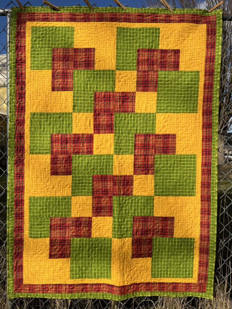 Gold, green, and red quilt