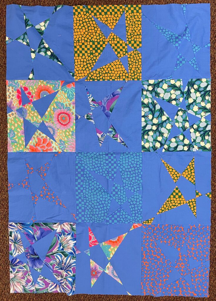 Blue quilt with wonky star blocks